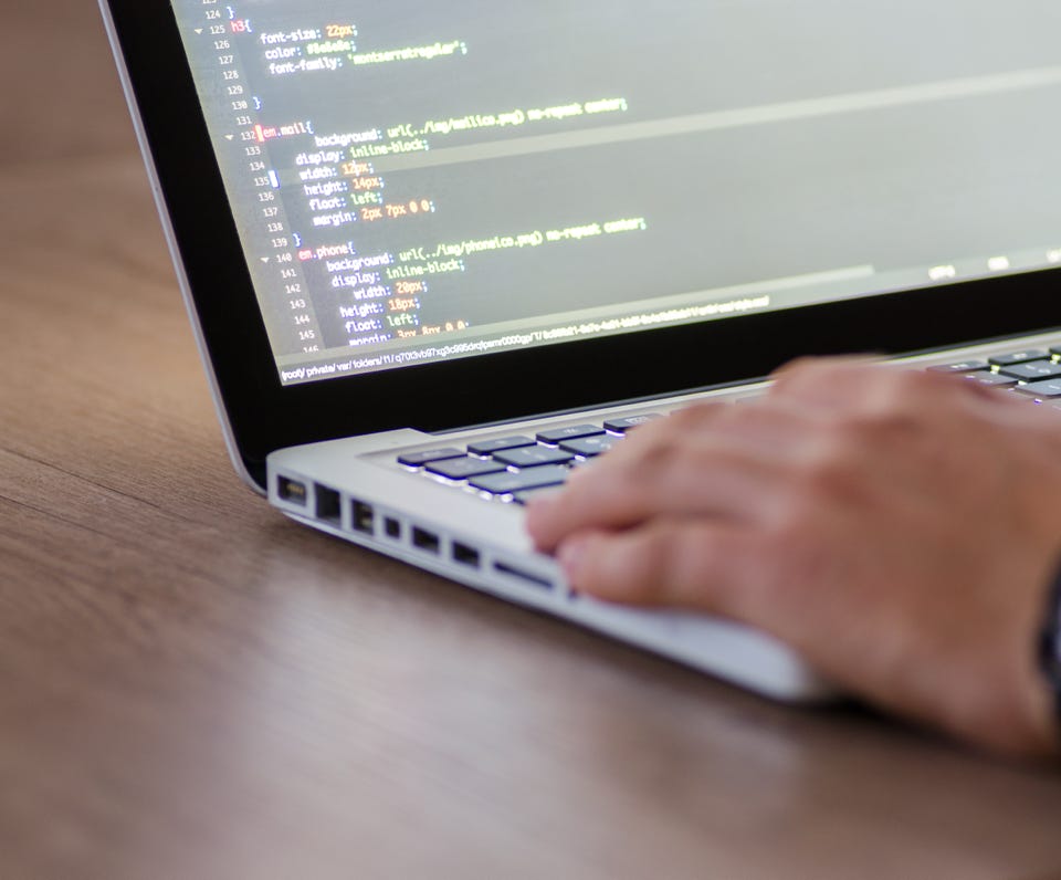 Person Using Macbook Pro